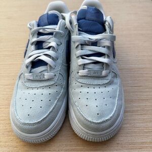 Nike Blue AF1 Sneakers with Air Cushioning, light blue with dark blue swoosh.